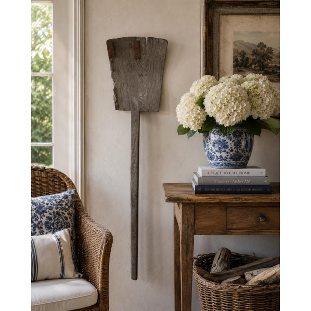 A wonderfully sculptural late 19th century wooden grain shovel, hand-hewn with a beautifully weathered surface that only...