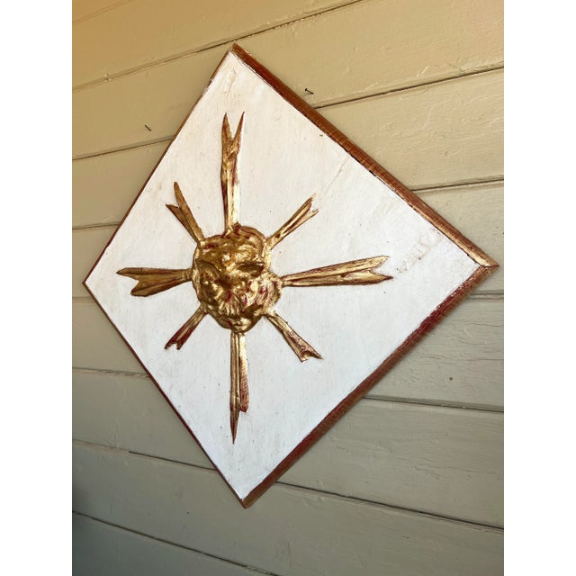 Beautiful detailed Italian baroque style giltwood and painted wall hanging diamond shape framed sunburst panel. The gilt...