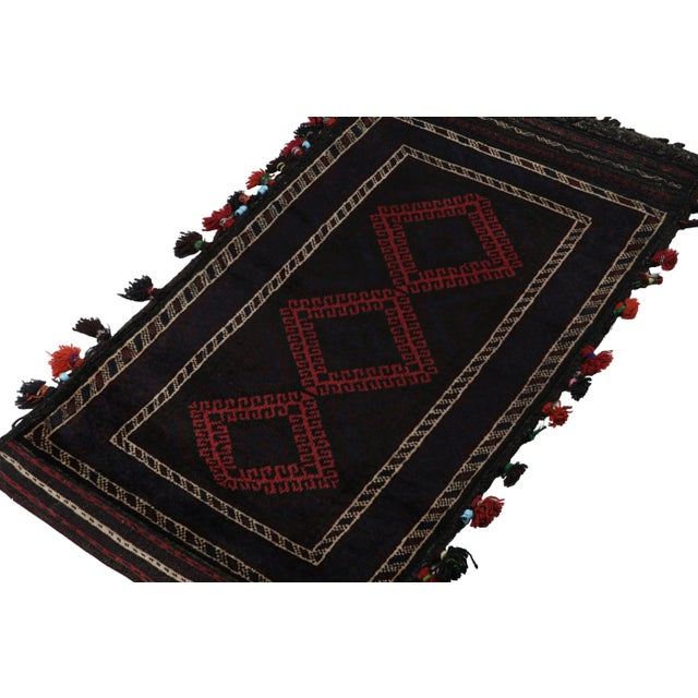 Hand knotted in wool, this 2x3 Baluch rug represents a new line of tribal carpets in the Modern Classics Collection by Rug...