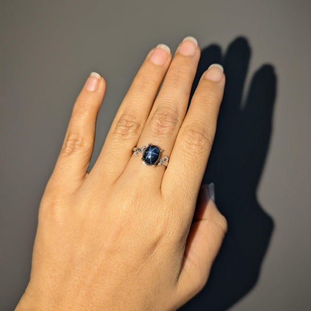 This mesmerizing 3.73ct Star Sapphire Ring features a stunning Diamond Accents, set in Solid 14K White Gold. Make a...