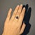 This mesmerizing 3.73ct Star Sapphire Ring features a stunning Diamond Accents, set in Solid 14K White Gold. Make a...