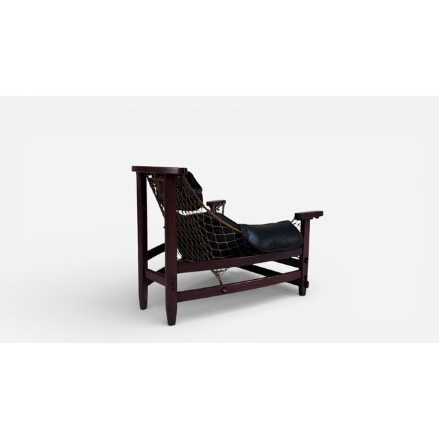 This exquisite vintage Jangada chair by renowned designer Jean Gillon is the perfect addition to any home. Handcrafted...