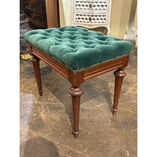 This product is an early 20th century English Charles X Style walnut bench with tufted upholstery in green. A handsome...