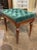 This product is an early 20th century English Charles X Style walnut bench with tufted upholstery in green. A handsome...