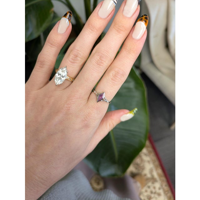 Kite-shaped pink sapphire framed with natural diamond accents for a bold yet elegant look. Crafted in solid 14K gold,...