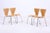 A classic set of four from Fritz Hansen's renowned Series 7, designed by Arne Jacobsen. The organically shaped plywood...