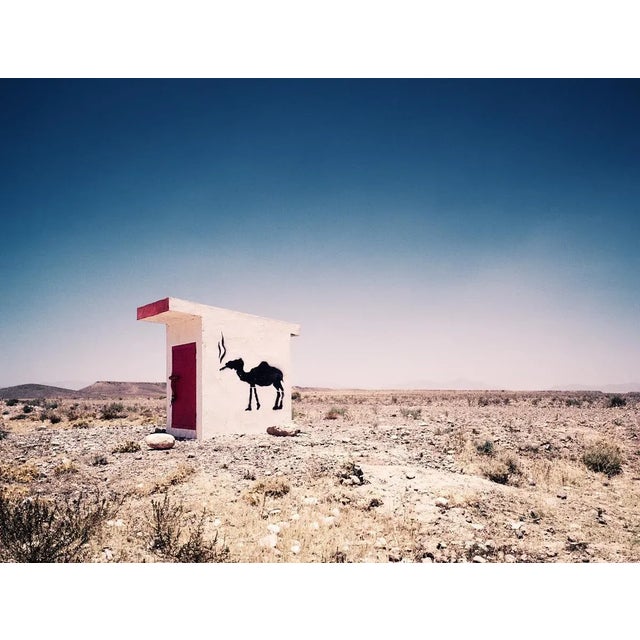 20" x 25" Archival Inkjet Print in Limited Edition of 25 A camel graffiti on the side of an outbuilding in the desert...