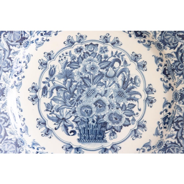 A monumental Dutch Delft wall charger plate by Royal Tichelaar Makkum, circa 1920. This lovely charger is one of the...