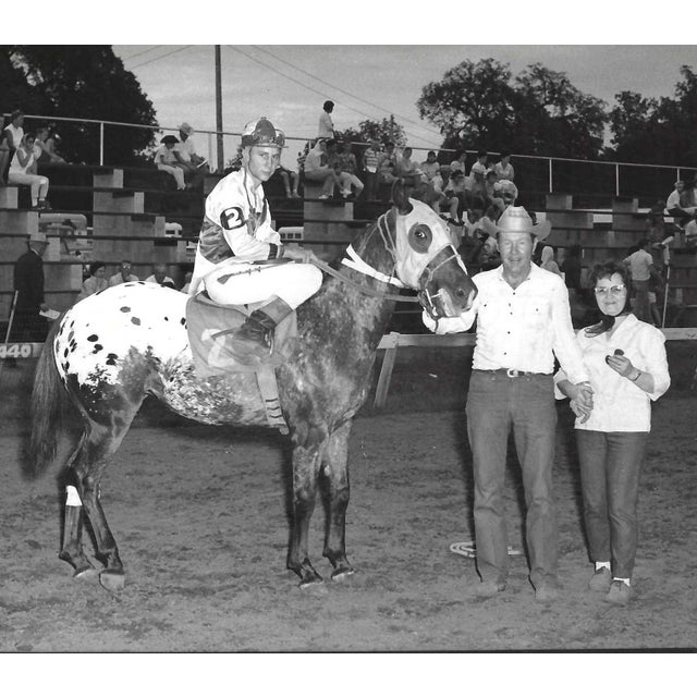 1965 black and white photograph of Sweepstakes in the winner's circle at Marble Downs in Carthage, Missouri. Jockey Steve...