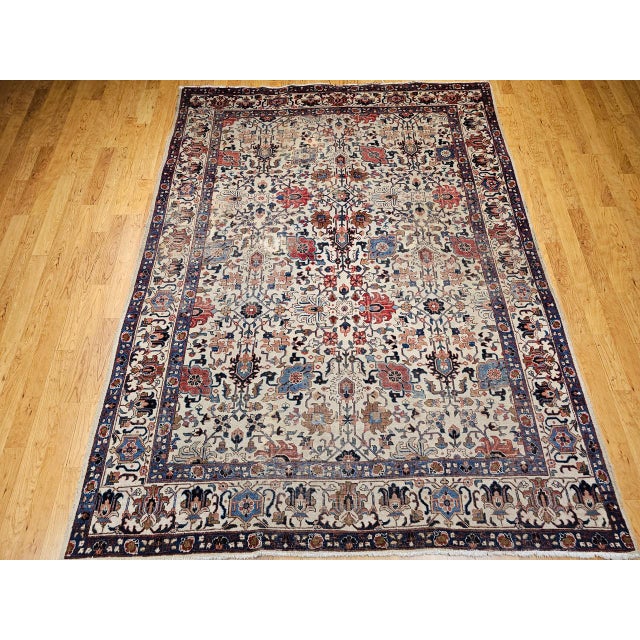 "This exquisite vintage Persian Tabriz room-size rug, woven in the third quarter of the 20th century, features a vibrant...