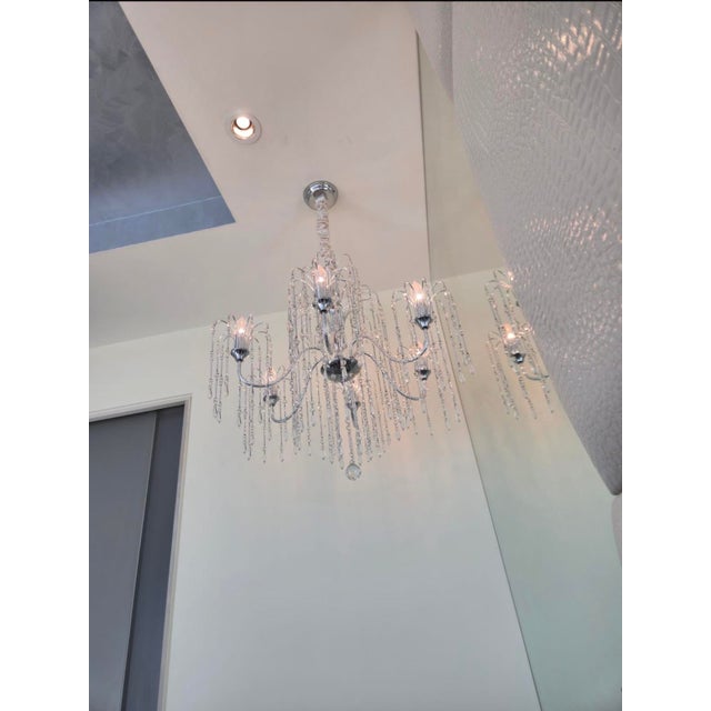 Set of 2 matching crystal chandeliers in excellent conditio All lights working perfectly.Beautiful multi-arm crystal...