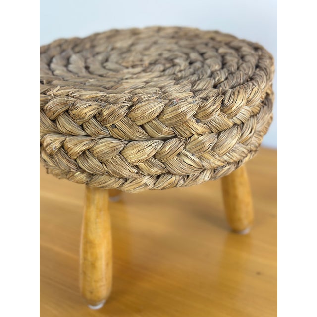 Authentic French Audoux Minet stool from the 1960s, featuring a handwoven seat and a sculptural tripod base in oak. A...