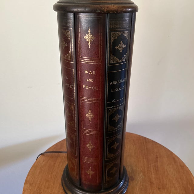 This vintage Frederick Cooper Trompe I’Oeil Book Motif Table Lamp features a unique column design with a shaded motif that...