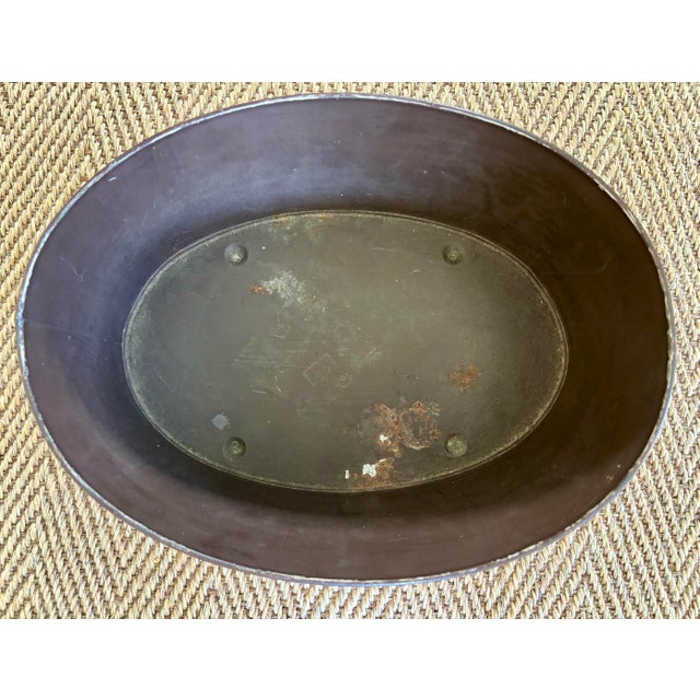 Striking cachepot in a French monteith shape with a marbleized decoration in shades of mustard, chocolate, and cream....