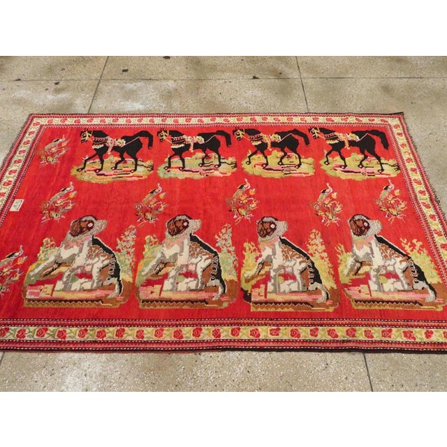 This striking mid-20th-century Caucasian Karabagh pictorial rug, exemplifies the region's rich tradition of narrative and...
