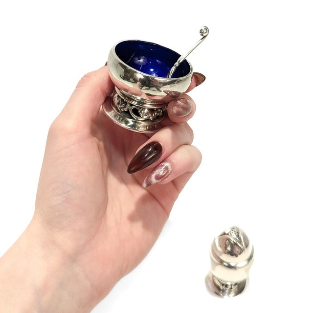 A fine signed Danish Modern pepper shaker and open salt cellar pair. By Georg Jensen. In sterling silver. Pattern no. 2A,...