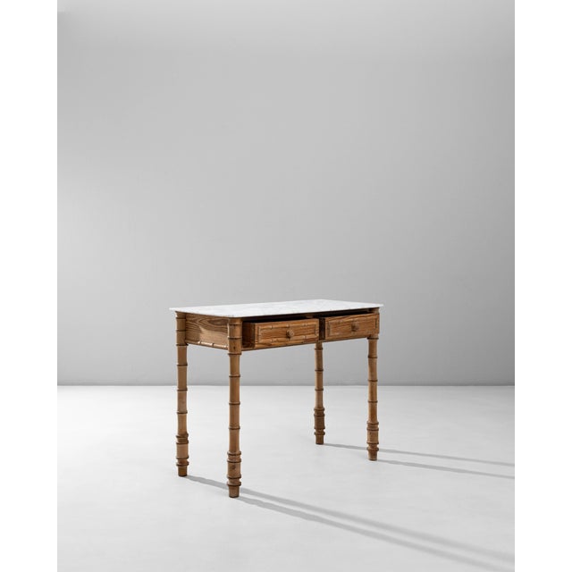1900s French Faux Bamboo Table With Marble Top. This refined French table from the early 20th century showcases the charm...