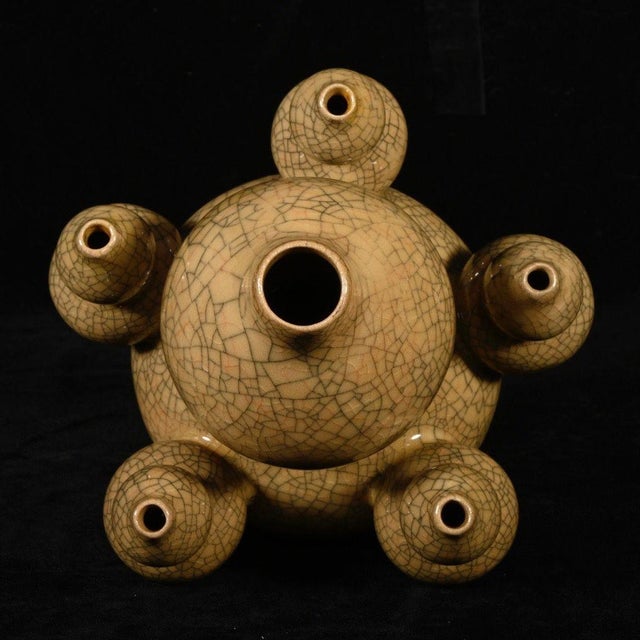 A striking and unusual Chinese porcelain vase featuring a classic Ge-type crackle glaze. The piece is modeled as a large...