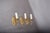 Set of three matching 1950s single-arm wall sconces in the Louis XVI style. Each solid gilt-metal sconce has an oval...