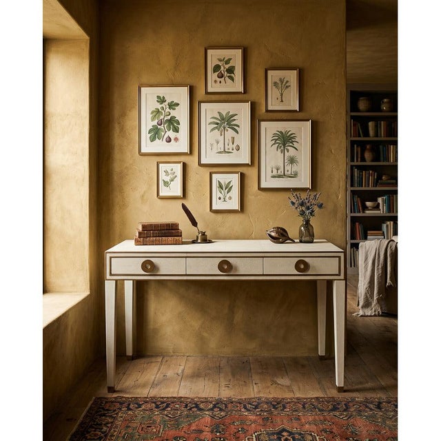 White shagreen covers the top and sides, brass banding traces the edges, and three drawers open on round brass rings,...