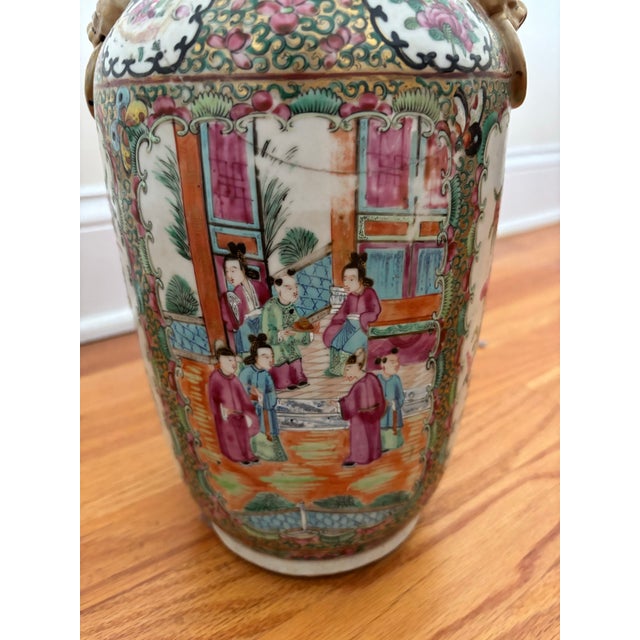An authentic, late 19th-century Chinese export porcelain baluster-form vase executed in the traditional Rose Medallion...