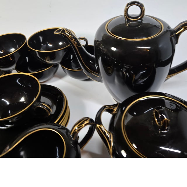 This is the ultimate tea set. Sleek lines in jet black are hand painted in a simple but sophisticated wheat pattern. This...