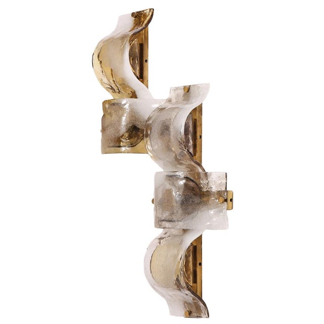 Sconce style with 5 pieces of handblown glass shades. Elegant yet expressive, the fixture reflects the refined modernism...