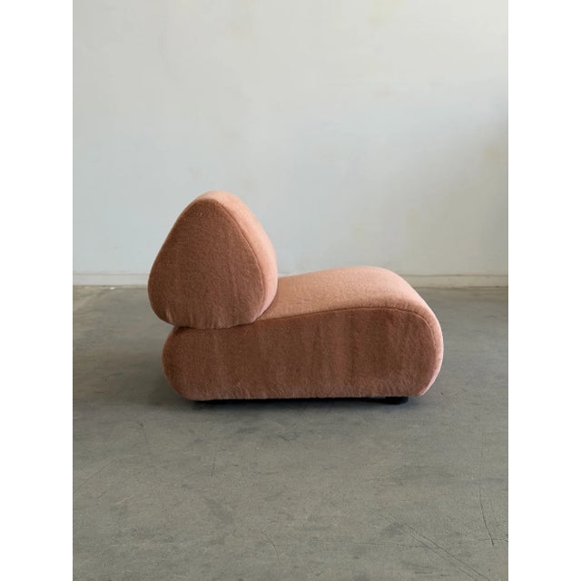 W30 D36 H28 SW29 SD20 SH15 This floor model is upholstered in a deadstock pink high pile mohair. Isosceles single lounge...