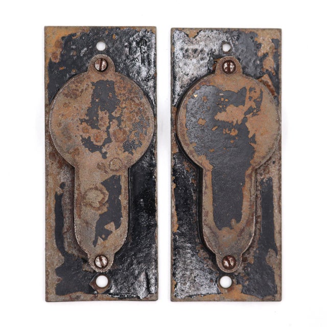 Antique Eastlake style recessed pocket door pulls made of copper finish cast iron. The original mounting screws are not...