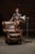 c. 1990s; Walter E. Smithe Furniture and Design - Itasca, IL Wingback-style leather armchair with ottoman and pillow....