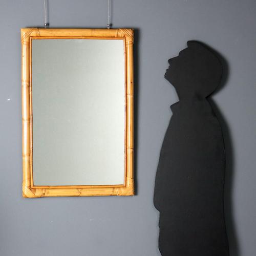 Vintage rectangular mirror made in Italy with a bamboo and wicker frame. This piece is attributed to the mentioned...