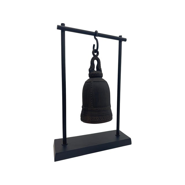 This striking hanging bell sculpture combines traditional form with a modern presentation. Crafted in matte black with...