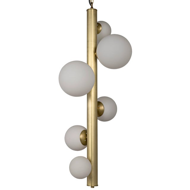 Mid-century modern lines in antique brass finished metal support six glowing orbs in this retro-futurist take on a classic...