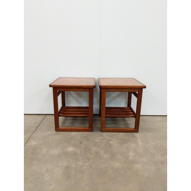 Pair of authentic vintage mid century modern teak and tile side tables / end tables / nightstands. This set is in...