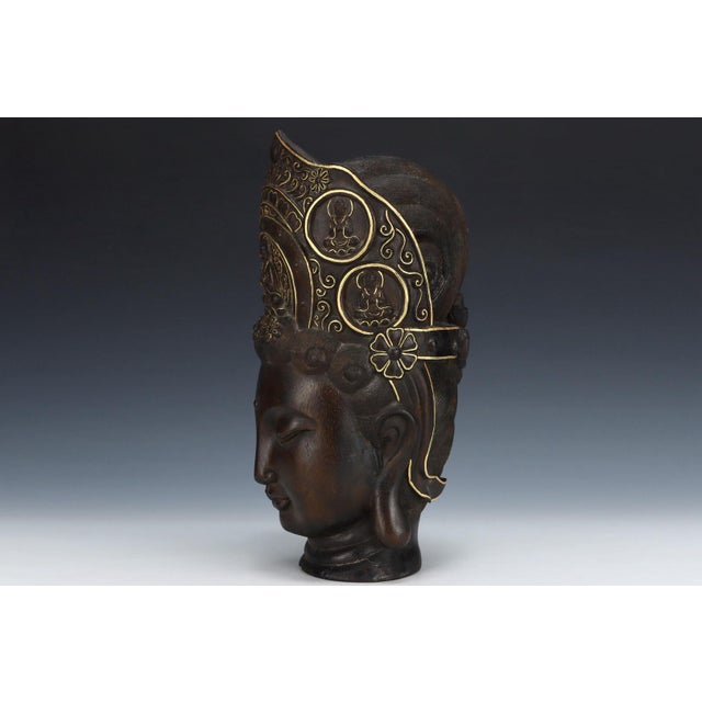 This refined sculpture is meticulously hand-carved from natural agarwood (Chen Xiang), valued for its rare fragrance,...