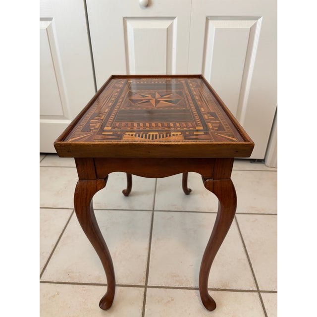 Early 20th‑Century Queen Anne Style Mahogany Tea Table with Hand‑Cut Marquetry Top A finely crafted Queen Anne style tea...
