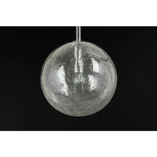 Doria ceiling light with nice murano glass ball. High quality of materials, gives a wonderful light effect when it is on....