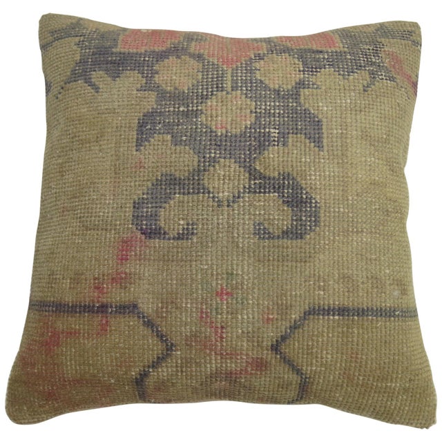 Pillow made from a vintage Turkish rug with pops of pink.