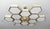 Impressive Italian chandelier with 12 hexagonal glossy white glass diffusers, mounted on thick hexagonal brass cells in...