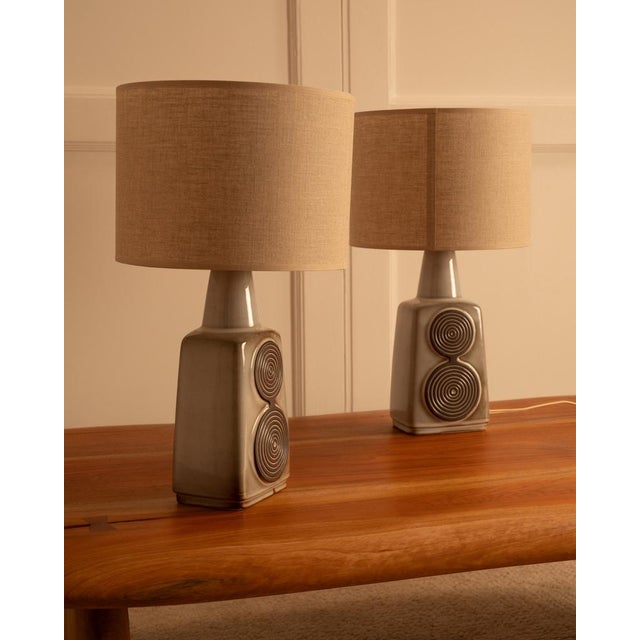 Pair of soholm stentoj ceramic lamps - denmark, 1960s each lamp is glazed in a light gray and decorated with dark brown...