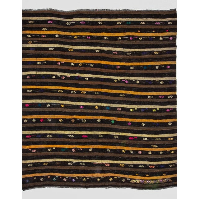 Striped vintage kilim rug from Afyon region of Turkey. Approximately 50-60 years old. In very good condition.