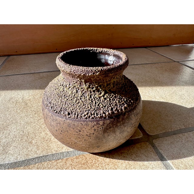 This impressive studio ceramic art vase in brutalist style was created in Germany during the 1960s. It features a special...