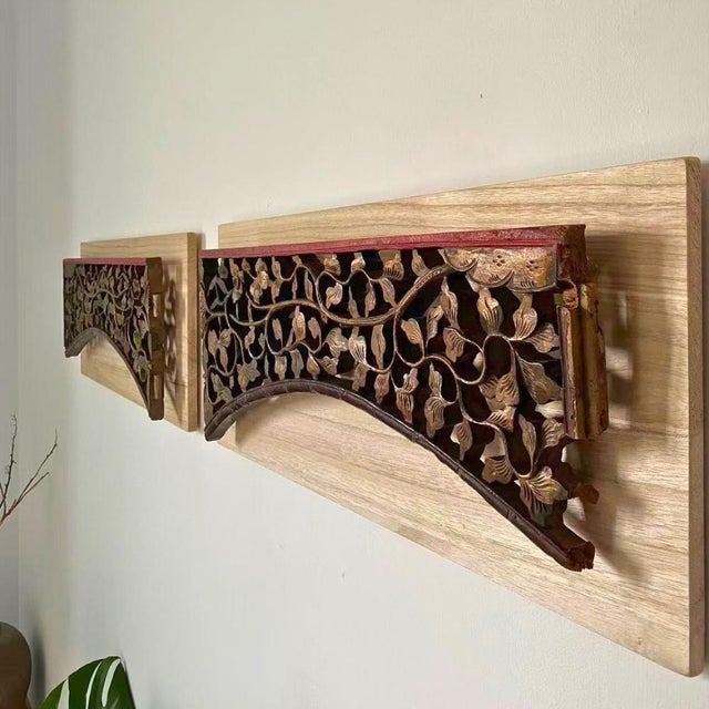 A pair of c.1890 Chinese giltwood carved arch panels, each mounted on its own solid wood backplate with a 2 cm floating...