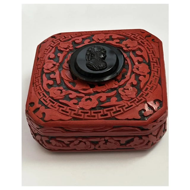 I elevated this lovely vintage hand carved Cinnabar box to a One of a Kind by attaching the lovely antique Jet cameo. The...