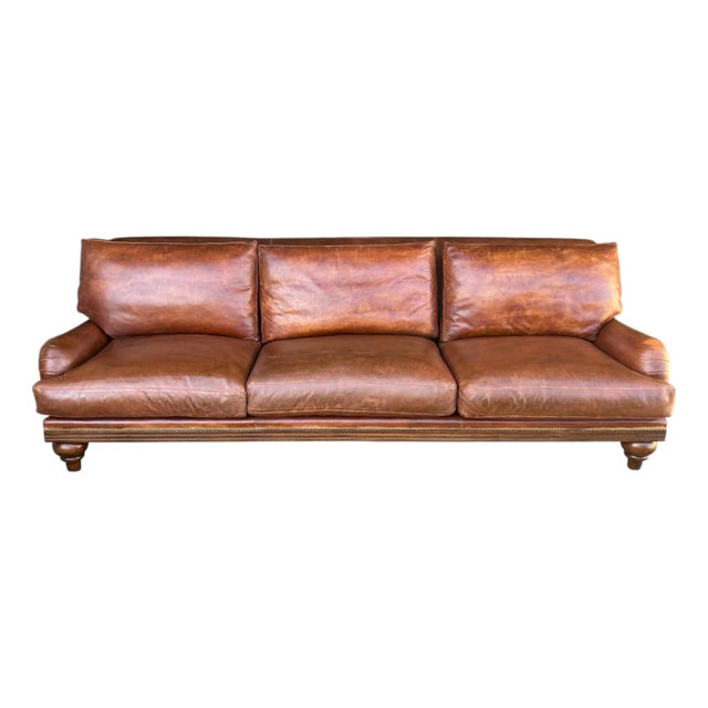 1970s English Traditional Light Brown Leather Sofa With Nail Head Trim & Carved 6-Leg Base For Sale