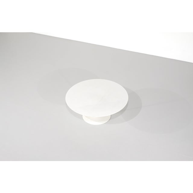 Tulip coffee table with a round white laminate top and white base. Designed by Eero Saarinen for Knoll International in...