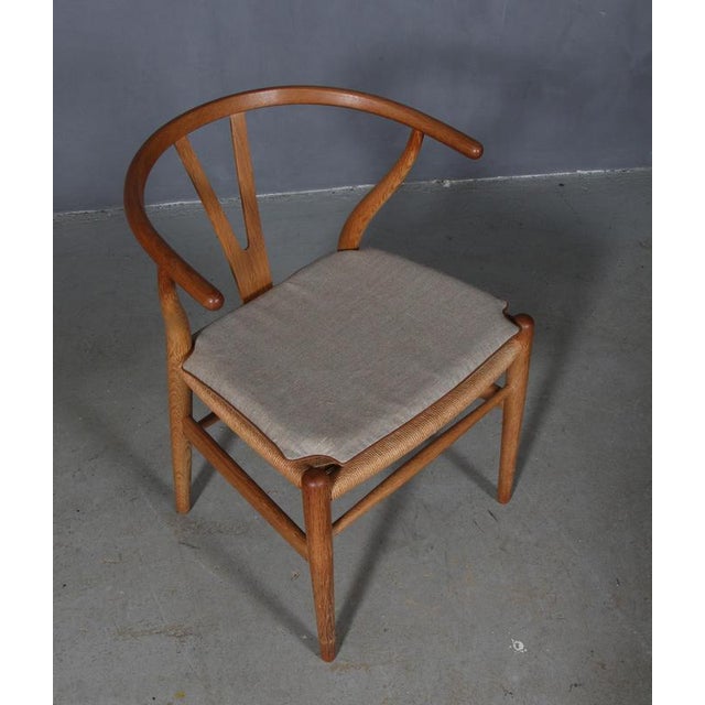 Hans J. Wegner cushions for wishbone chair model CH24. Made in canvas with leather tubing and good quality foam. Only the...