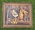 A finely executed vintage trompe-l’oeil oil painting depicting a collection of Western ranch objects including horseshoes,...