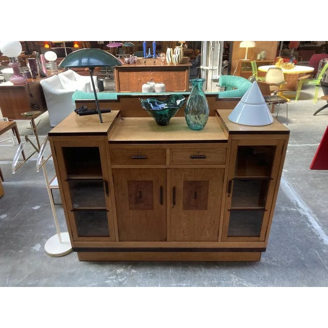 Mid-sized bar cabinet or buffet, featuring the clean and unfussy lines of the Amsterdam School style movement of the 30s,...
