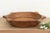 The sculptural form of this vintage bowl takes center stage. Carved from a single piece of solid hardwood, it features a...